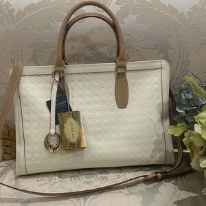 NWT Arcadia, genuine, patent leather cream and tan satchel with shoulder strap.